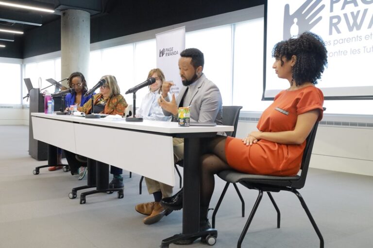 A group of people sitting at a table.