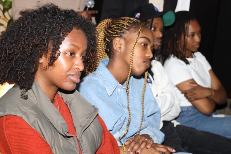 A group of people sitting in a room.