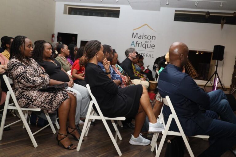 A group of people sitting in chairs at maison afrique