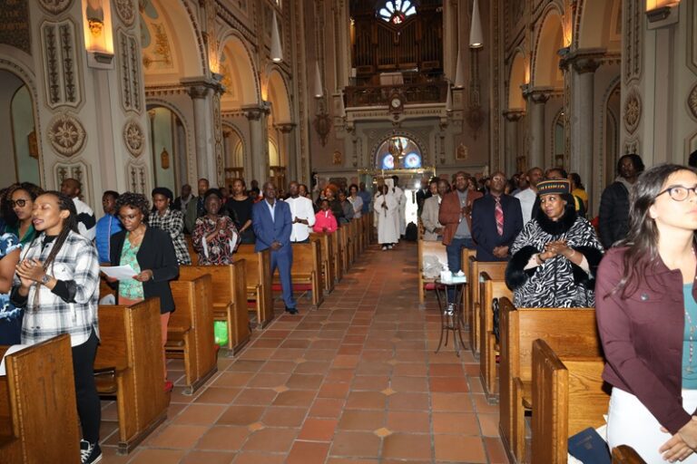 A group of people standing in the middle of an aisle.