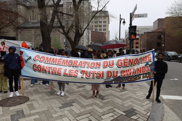 A group of people holding up a banner.