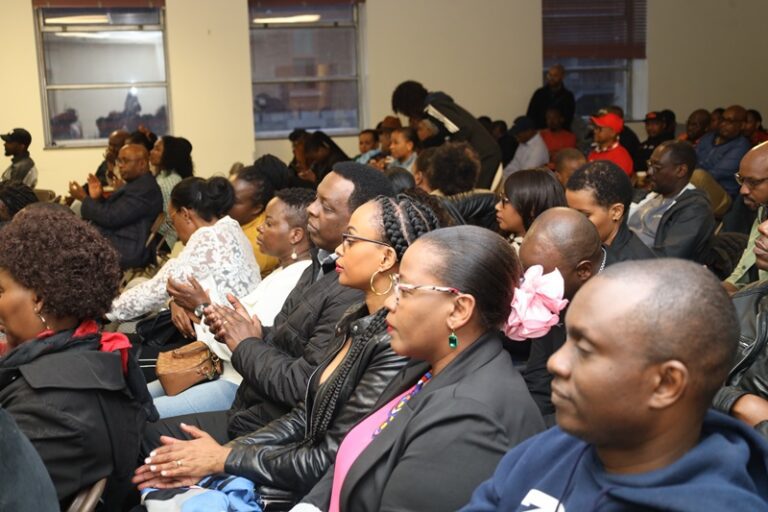 A group of people sitting in a room.