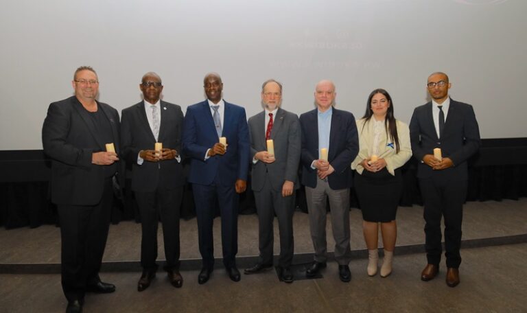A group of people holding up their awards.