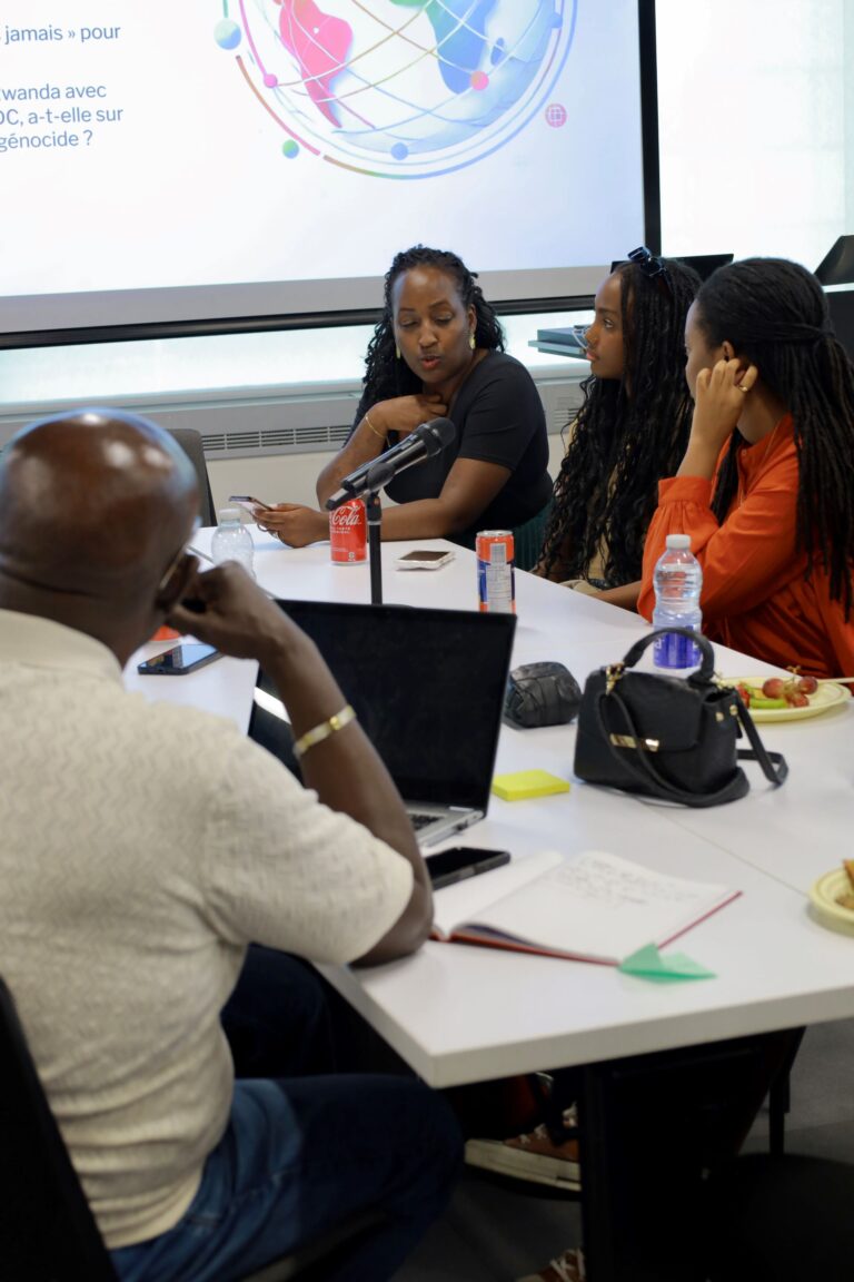 A group of people sitting around a table.
