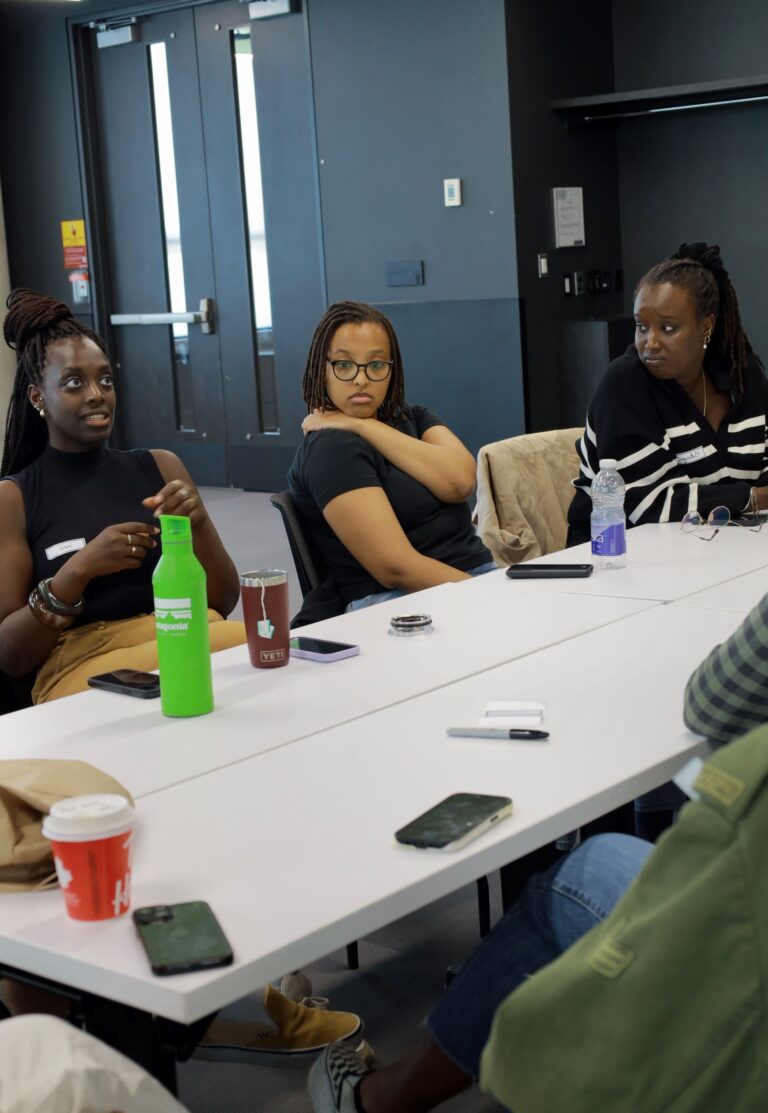 A group of people sitting around a table.