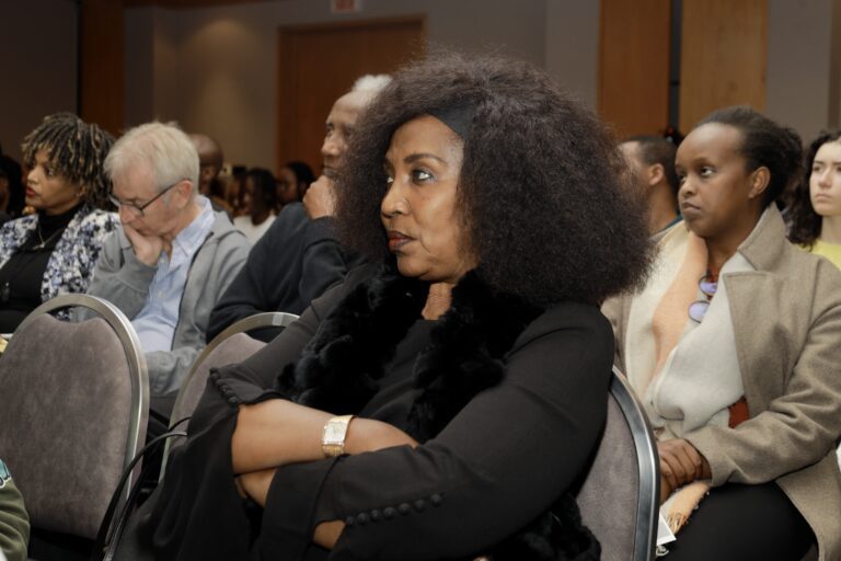 Audience attentively listening to a presentation.