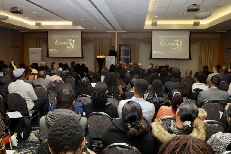 Audience attending a conference or presentation.