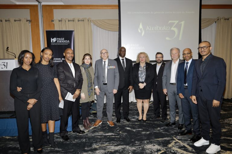 Group of people posing at a formal event.